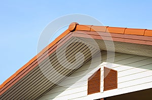 Urban roof gable with blue sky