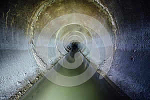 Urban sewage flowing throw round sewer tunnel pipe