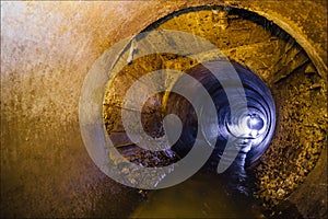 Urban sewage flowing throw round sewer tunnel pipe