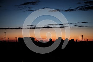 Urban silhouette city skyline and sunset / sunrise.