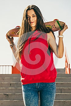Urban skate girl with skateboard.