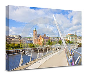 Urban skyline of Derry city also called Londonderry in northern Ireland with the famous Peace Bridge