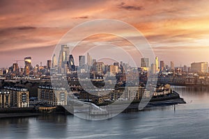 The urban skyline of London during a colorful sunset