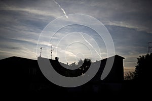 Urban Skyline Silhouette Against Blue Sky