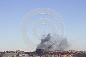 Urban Skyline with Smoke Plume