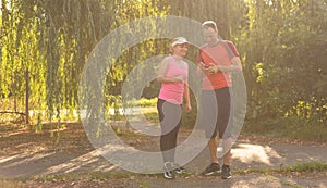 Urban sports - couple jogging for fitness in the city on a beautiful summer day