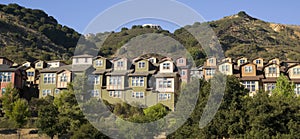 Urban Sprawl Dwellings Spring up For Domestic Living on Hillside photo