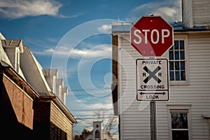 Urban stop sign and railroad crossing