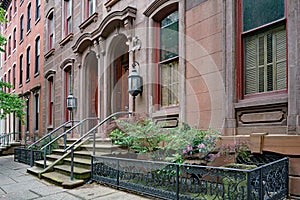 Urban street with old brownstone style townhouses