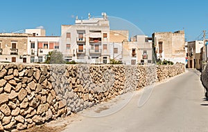 Urban street with typical mediterranean houses on the island Favignana, Sicily