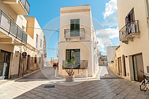 Urban street with typical mediterranean houses on the island Favignana in Sicily, Trapani, Italy