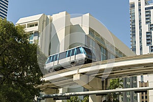 Urban transportation in downtown district of Miami Brickell in Florida USA. Metrorail city train car on high railroad