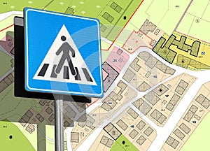 Urban zone 30 concept with pedestrian crossing placard and imaginary city map