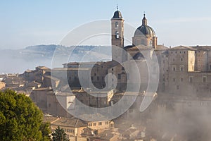 Urbino city lost in the fog on early morning