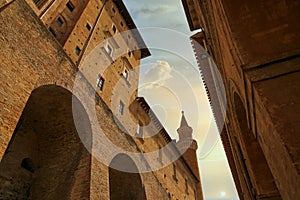 Urbino, Italy - August 9, 2017: architectural elements of a building in the old town of Urbino. Red brick and windows with