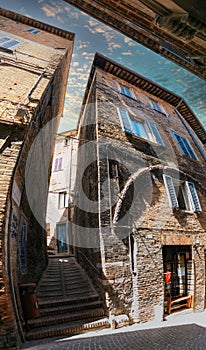 Urbino, Italy - August 9, 2017: A small street in the old town of Urbino. sunny day