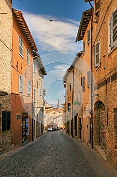 Urbino, Italy - August 9, 2017: A small street in the old town of Urbino. sunny day