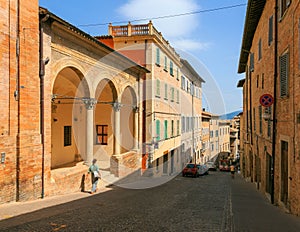 Urbino, Italy - August 9, 2017: A small street in the old town of Urbino. sunny day.