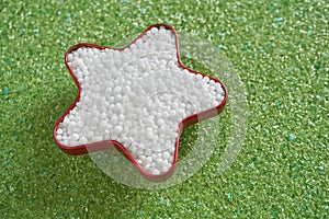 Urea fertilizer in star shape on green magnesium fertilizer