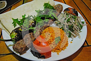 Urfa kebap with rice and salad