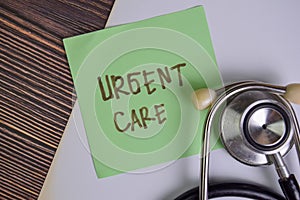 Urgent Care write on sticky notes isolated on Wooden Table