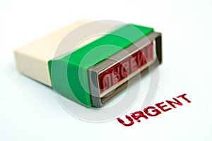 Urgent letter on green rubber stamp