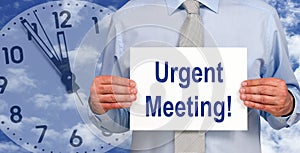 Urgent Meeting - Manager holding sign with text