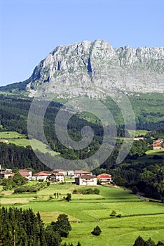 Urigoiti neighborhood under the karstic massif of Itxina. Gorbeia Natural Park. Orozko. Basque Country. Spain