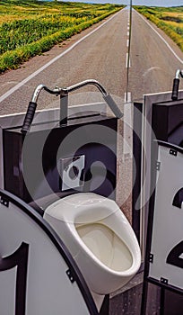 Urinal in the men's room in the form of a bicycle, handlebar and road to the field. Original bathroom design