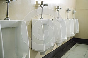 Urinals for men in men`s toilet