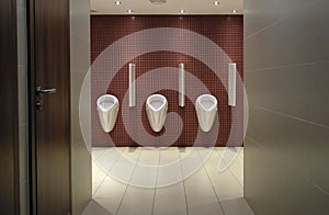 Urinals in a men\'s restroom