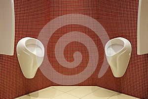 Urinals in a men\'s restroom