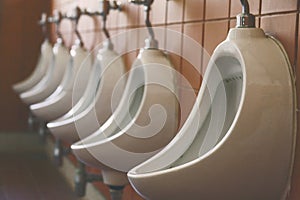 Urinals in menâ€™s bathroom / Male urinals