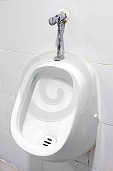 Urinals white, close up white urinals in men`s bathroom, white ceramic urinals for men in toilet room