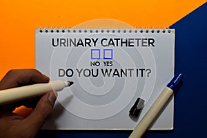 Urinary Catheter, Do You Want it? Yes or No. On office desk background