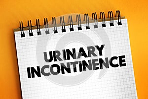 Urinary incontinence - leaking of urine that you can`t control, text concept on notepad