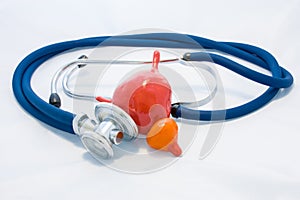 Urine bladder with ureters and prostate gland is located next to stethoscope, which encircles anatomic model and diagnoses conditi