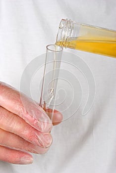 urine from a bottle in to a test tube