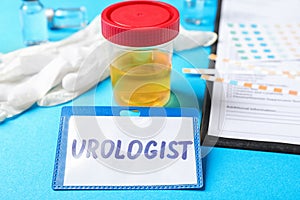 Urine sample and card with word UROLOGIST