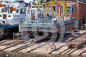 Urk, The Netherlands - June 22 2020: Two yachts for repair and maintenance in the dockyard of Urk, the Netherlands