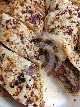 Urkish Beyti Kebab Served with Bulgur Pilaf and Yoghurt.