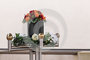 An urn with flowers shortly before the funeral