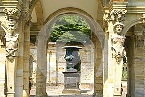 Urn and sculptured archway at Hever Castle Garden in England