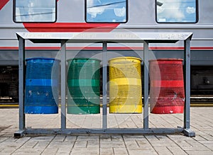 Urns for separate collection of garbage on the platform of the railway station