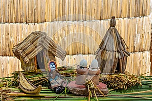 Uros islands tribe crafts at Titikaka lake, Peru photo