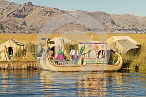 UROS, PERU - JULY 29 2012: Family living on floating reed island Uros at lake Titicaca Peru Bolivia