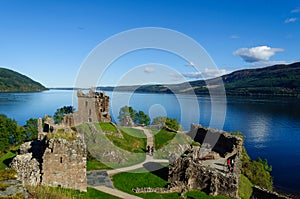 Urquhart Castle in the summer with a beautiful blue sky photo