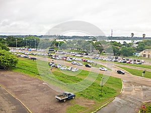 Many cars and buses parked near the border control between Brazil and Argentina - Uruguaiana/RS photo