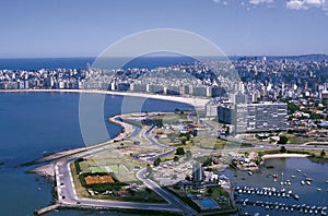 Uruguay aerial view of the city of Montevideo, the picturesque Pocitos beach and the Aresanal del-Buceo port photo