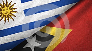 Uruguay and Timor-Leste East Timor two flags textile cloth, fabric texture photo